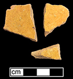 Indeterminate vessel of yellow border ware as identified by J. Pearce 1999. Glazed interior sherds on pink paste on left, and unglazed exterior sherds on right. 